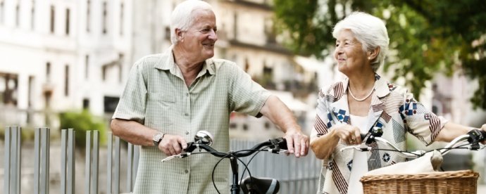 man-and-woman-enjoying-bike-ride-in-residential-neighborhood